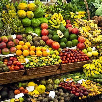 Colourful fruit and vegetable market stall in a rustic display